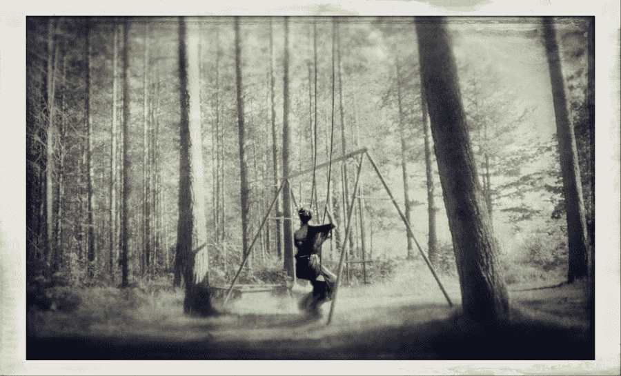 Ana Priscila Rodriguez photograph of woman in woods on a swing