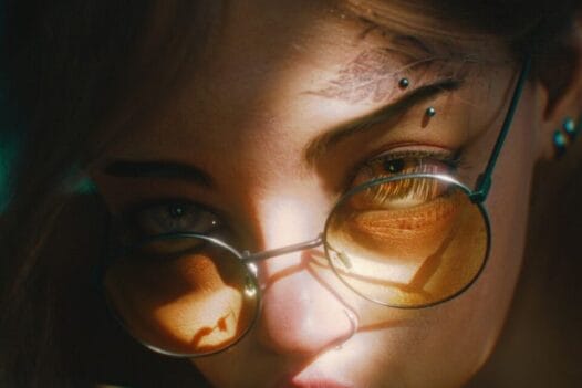 VZEWL's 3D artwork of a woman with glasses and tattoo on her face