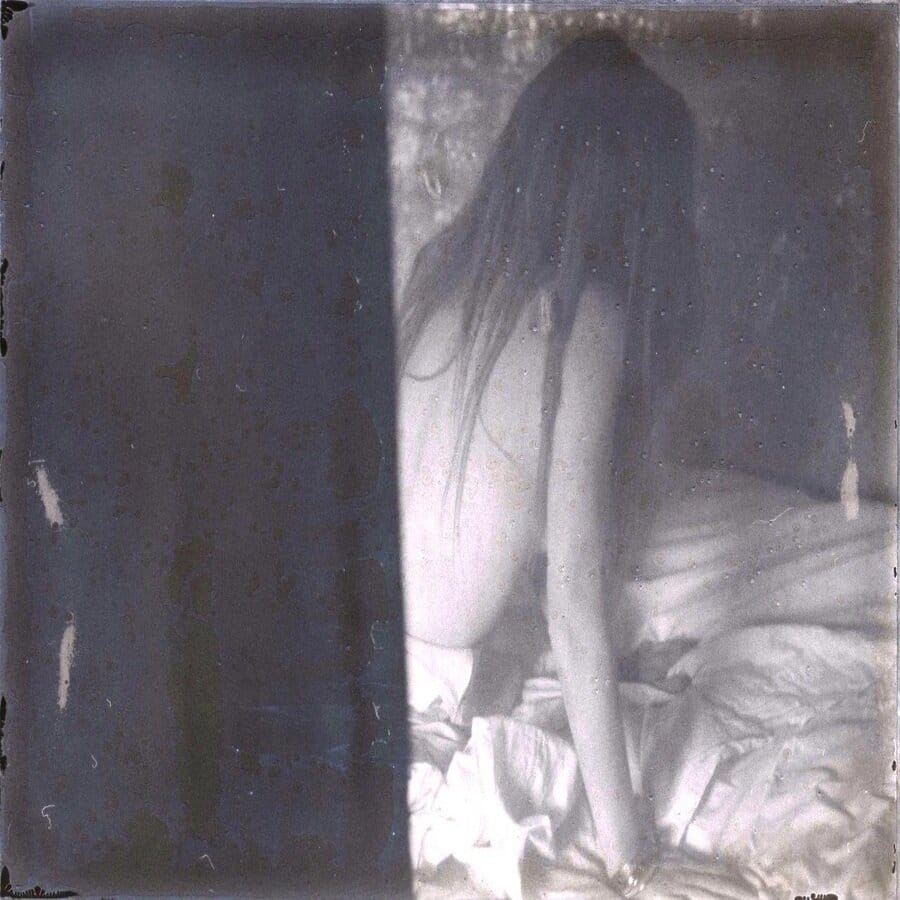 Brooke by Jeremy Mann, black and white photograph of a woman with her back turned on the camera 
