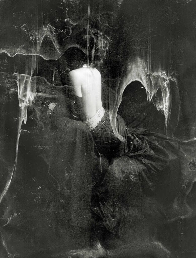 Abstract black and white image of a woman with her back turned on the camera by Jeremy Mann